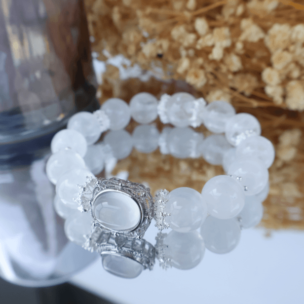 Snowflake Phantom Quartz bracelet on display with dried flowers