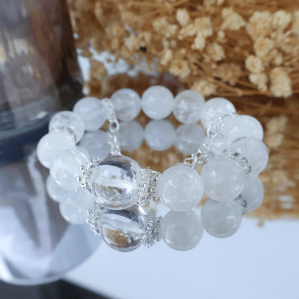 Reflective Snowflake Phantom Quartz bead bracelet on mirror
