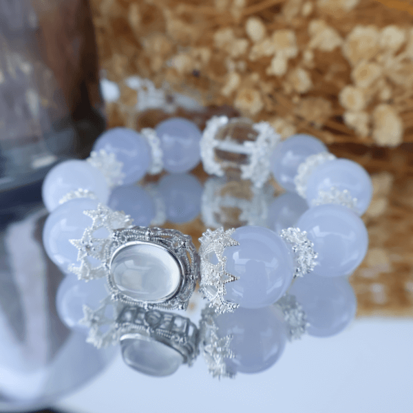Aquamarine crystal bead bracelet with reflective glass surface