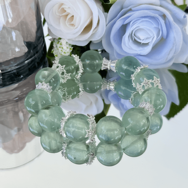 Green Ghost Phantom Crystal Bracelet with floral background