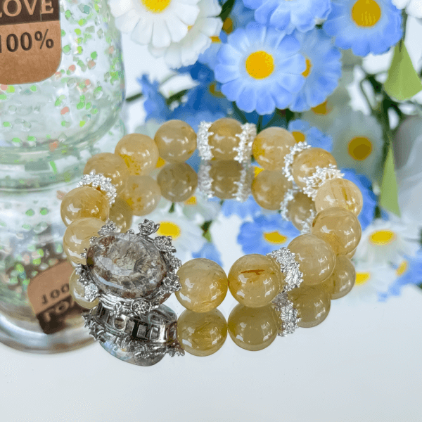 Golden Rutilated Quartz Bracelet with Floral Background
