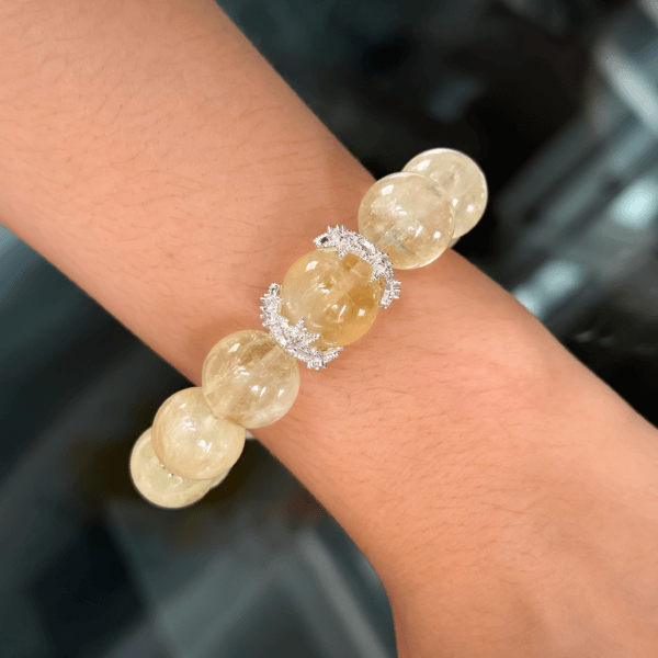 Yellow Azeztulite bracelet worn on wrist