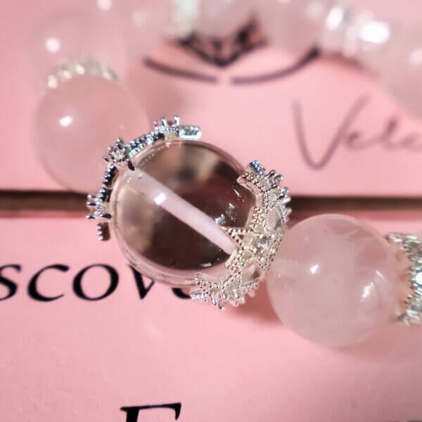 Rose quartz central bead with silver crown detail