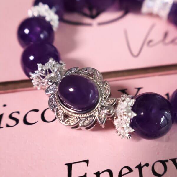 Close-Up of Amethyst Crystal Beads with Silver Details