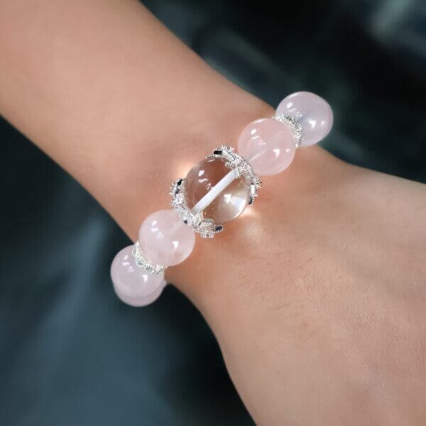 Pink Ocean rose quartz bracelet worn on wrist