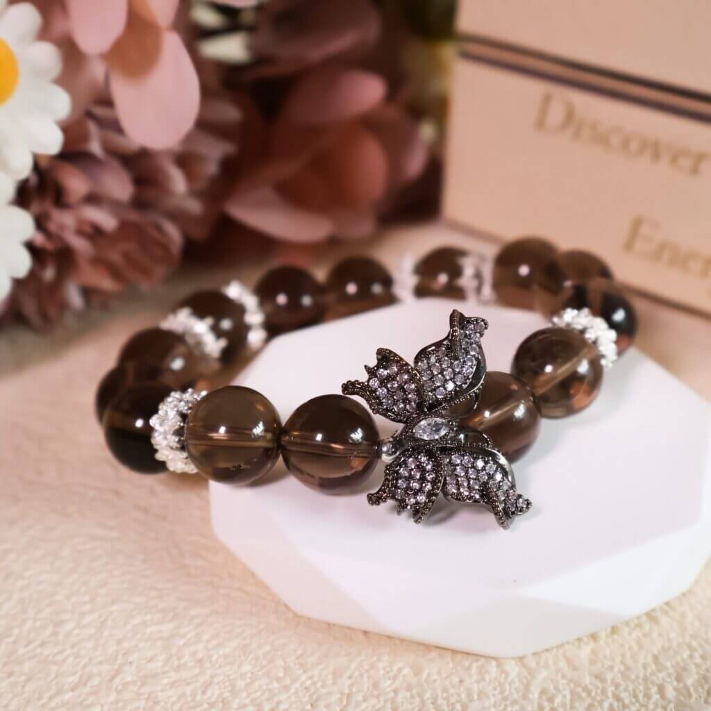 Smoky quartz crystal bracelet with butterfly charm in gift setting