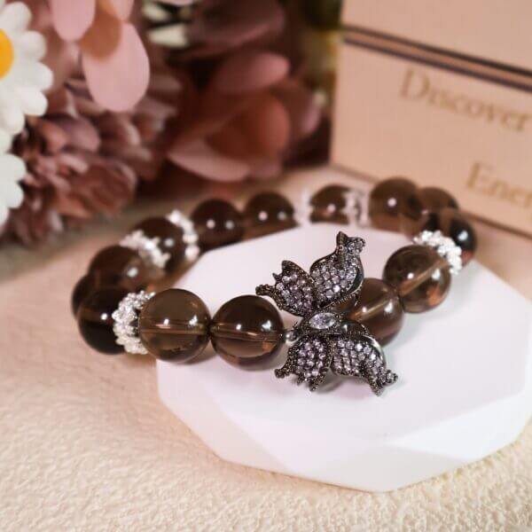 Smoky quartz crystal bracelet with butterfly charm in gift setting
