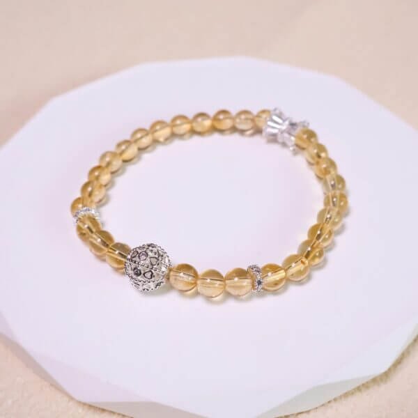 Yellow quartz bracelet with intricate silver centerpiece