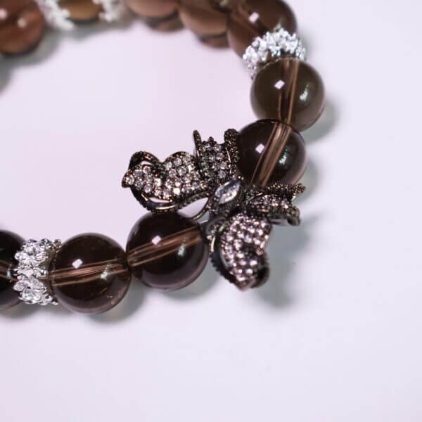 Smoky quartz bracelet featuring butterfly centerpiece and silver accents