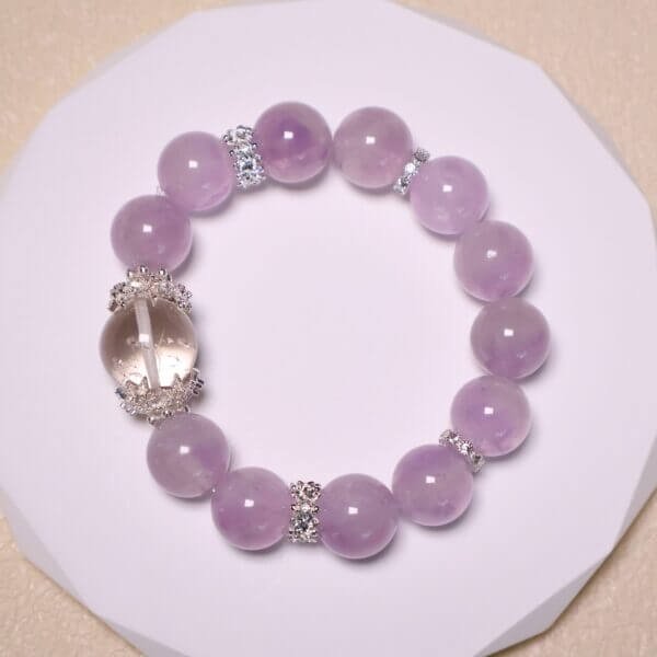 Handmade Lavender Amethyst Crystal Bracelet on White Display