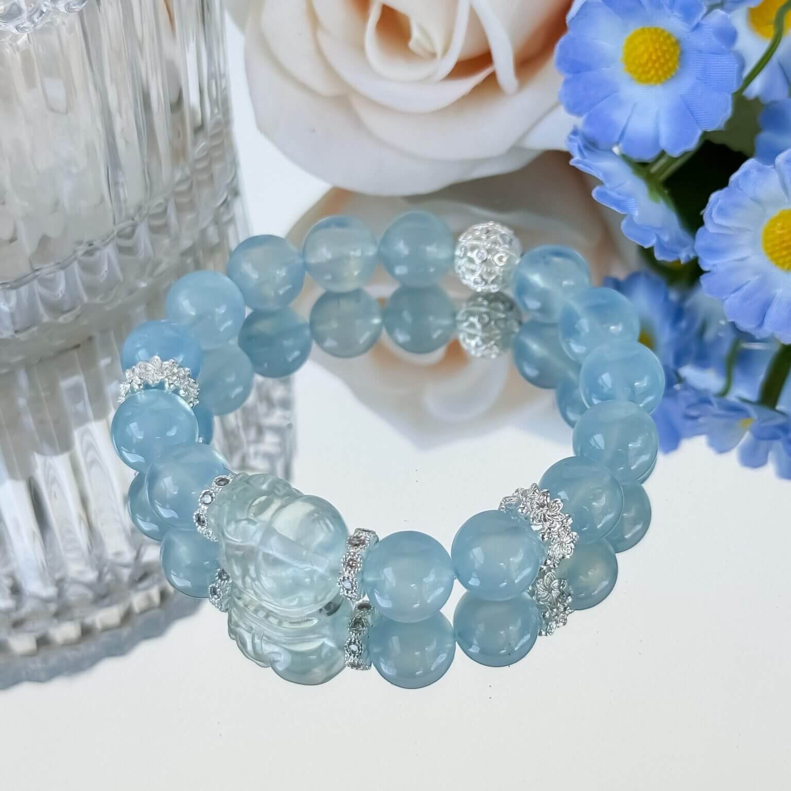 Blue Guardian Aquamarine Bracelet with Floral Background