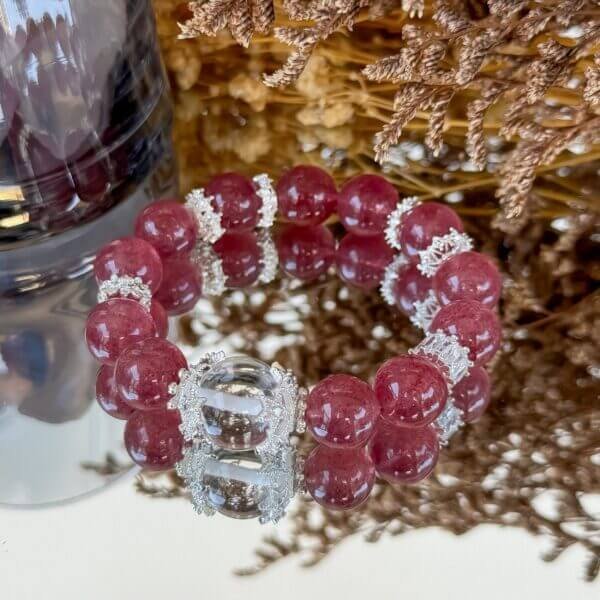 Strawberry Quartz Bracelet with Silver Accents on Display