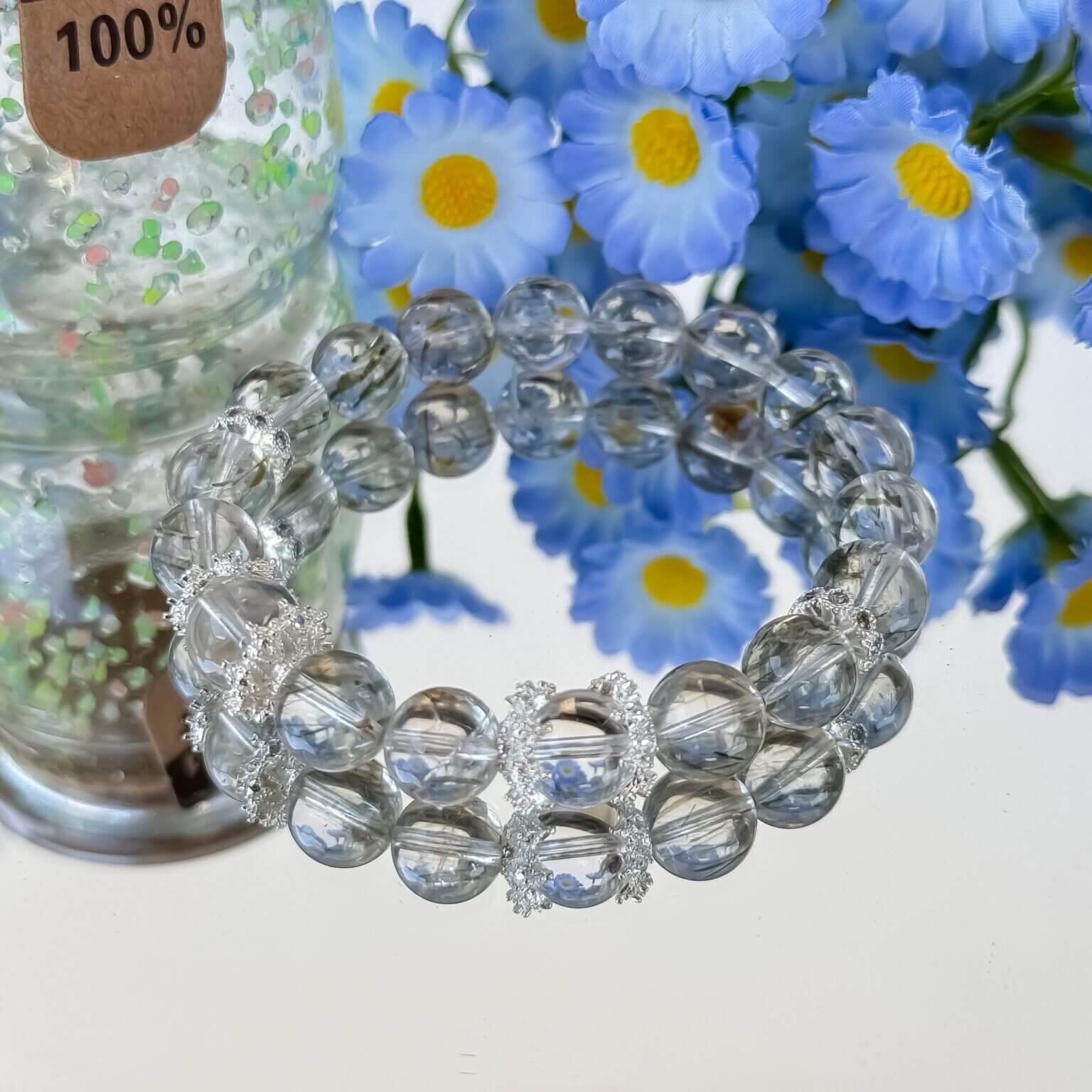 Green Rutilated Crystal bracelet with floral background