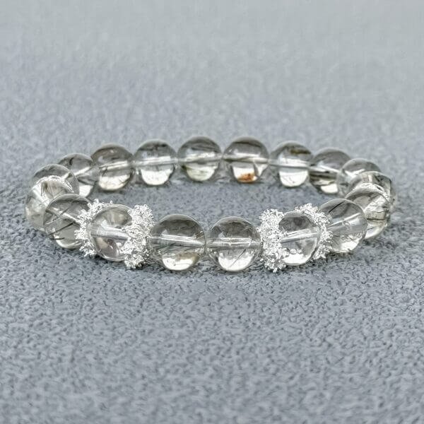 Green Rutilated Crystal bracelet with silver accents close-up