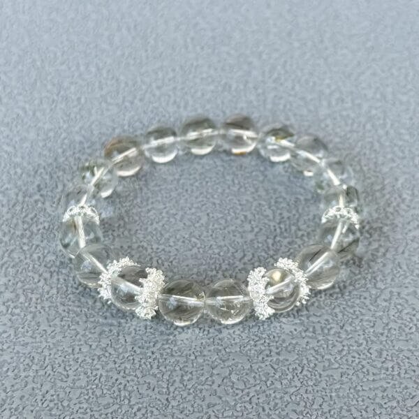 Green Rutilated Crystal bracelet with silver accents close-up