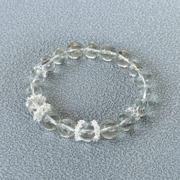 Green Rutilated Crystal bracelet with silver accents close-up