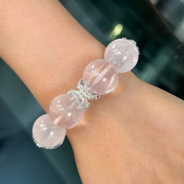 Madagascar Pink Crystal Bead Bracelet on Wrist with Silver Accents